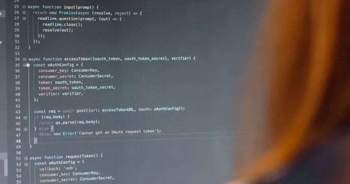Developer reviewing code on a monitor
